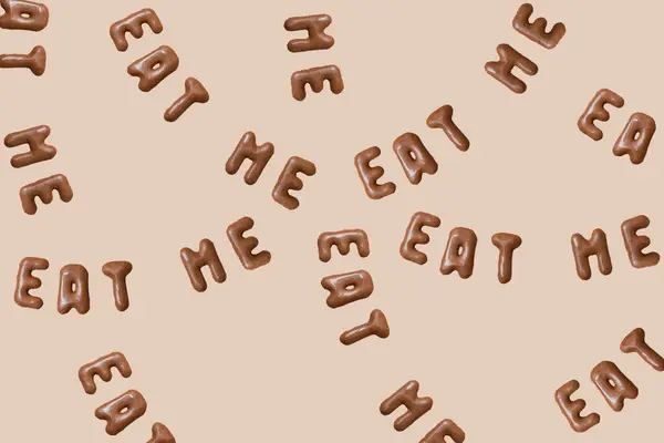 stock image Sweet composition with the words Eat Me on a beige background. Alphabet biscuits on a pastel background, top view, copy space