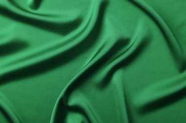 Koyu yeşil ipek kumaş arka plan. Metin için alanı olan zarif bir arkaplan. Noel ya da Yeni Yıl konsepti