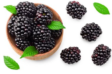 blackberries with leaves in wooden bowl isolated on white background. clipping path. top view