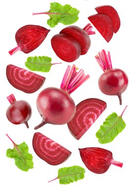 flying beetroot with pieces of beetroot and green leaf isolated on white background. clipping path clipart