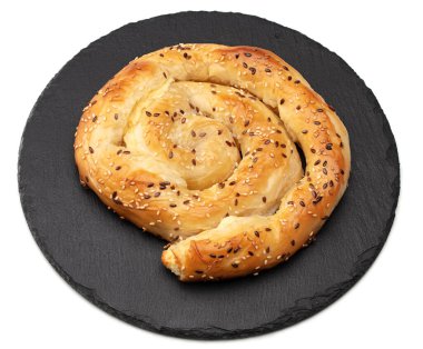 Bakery. Balkan feta cheese pie on black plate isolated on white background. clipping path clipart