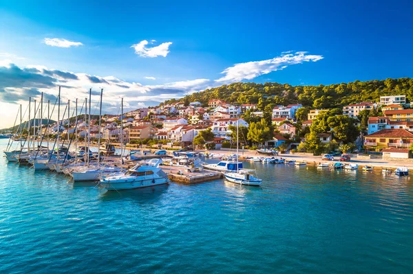 Coastal town of Tisno scenic harbor and coastline view, bridge to island of Murter, Dalmatia, Croatia
