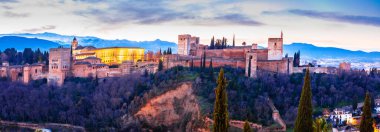 Panoramic view of historic Alhambra in city of Granada at dawn, Andalusia region of Spain