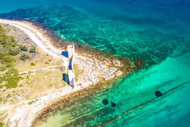 Island of Vir stone beach and fortress ruins aerial view, Dalmatia region of Croatia