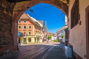 Freiburg im Breisgau historic cobbled street and colorful architecture view, Baden Wurttemberg region of Germany clipart