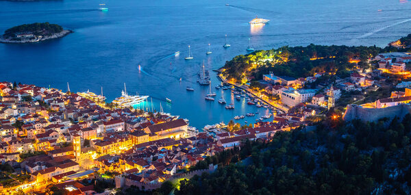 Aerial view of Hvar rooftops and harbor evening panoramic view, Dalmatia archipelago of Croatia