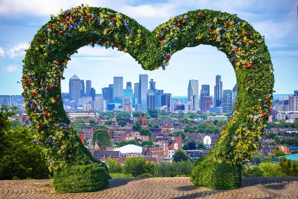 stock image City of London skyline view from Hampstead Heath through flower frame, capital of UK