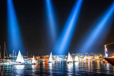 Krk historic sails night regatta with illumination, Island of Krk, Croatia clipart