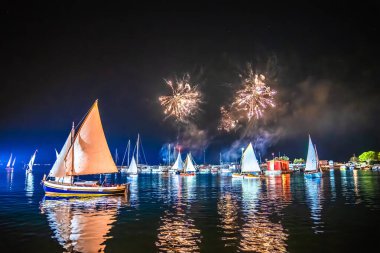 Krk historic sails night regatta with illumination and fireworks, Island of Krk, Croatia clipart