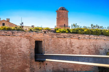 Walls of Marseille waterfront fortress and lighthouse view, southern France clipart