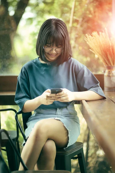 Asian Teenager Sitting Home Living Room Reading Message Smart Phone — Stock Photo, Image