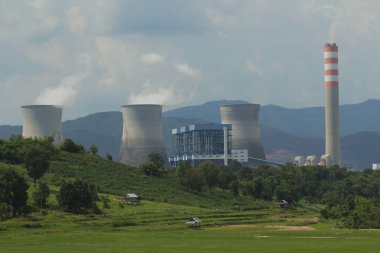 view from local road of hongsa electric power generation plant in sainyaburi northern of lao   clipart