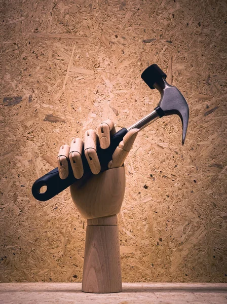 Simulated Wooden Hand Holding Steel Hammer Wood Background — Stock Photo, Image