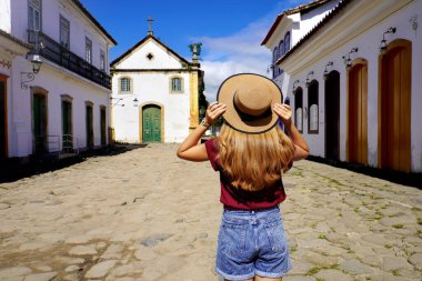 Beautiful girl visiting the historic city of Paraty, Rio de janeiro, Brazil