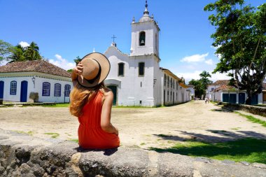 Tourist girl in Paraty historic cultural town in Rio de Janeiro State, Brazil
