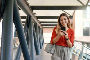 Young entrepreneur going to work in her successful start-up business about technology and green energy