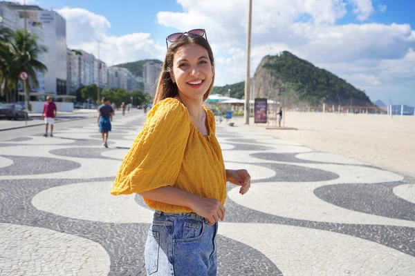 stock image Young woman walking on Copacabana promenade in Rio de Janeiro, Brazil