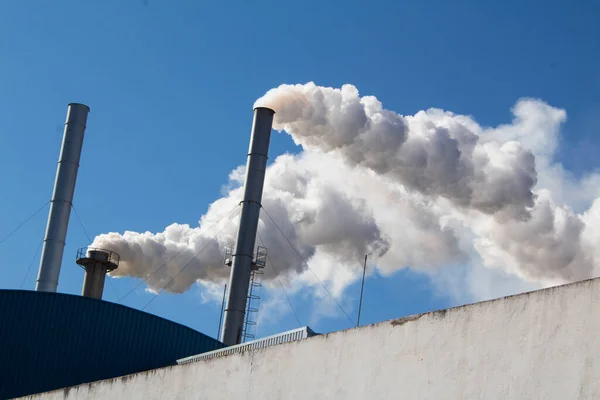 Smoke chimney, oil factory in the mountains of Toledo, Spain