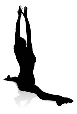 Yoga yapan ya da pilates yapan bir kadının silüeti.