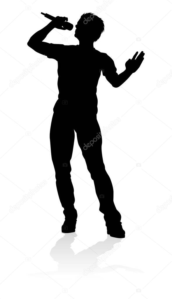 A singer pop, country music, rock star or hiphop rapper artist vocalist singing in silhouette