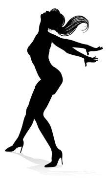 Siluet içinde dans eden bir kadın dansçı.