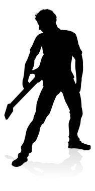 Gitar enstrümanını çalan, siluetli bir gitarist..