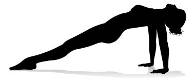 Yoga yapan ya da pilates yapan bir kadının silüeti.