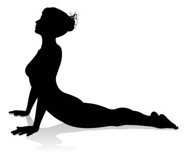 Yoga yapan ya da pilates yapan bir kadının silüeti.