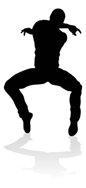 stock vector A male street dance hip hop dancer in silhouette