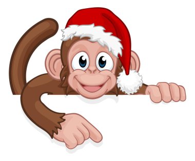 Noel Baba şapkalı bir Noel maymunu bir tabelanın arkasına bakıp onu işaret ediyor.