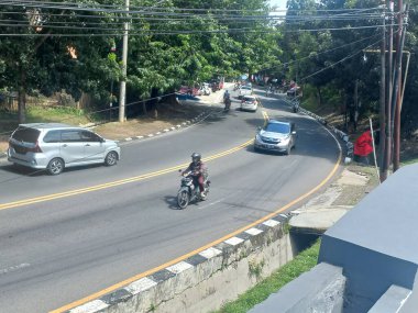people riding on motorcycle at the city of semarang