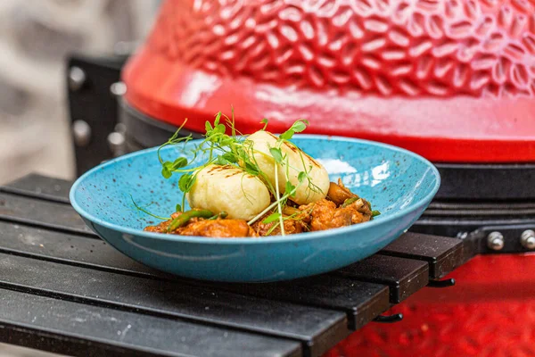 stock image Hungarian goulash with a bread dumpling prepared on the grill. Close up 