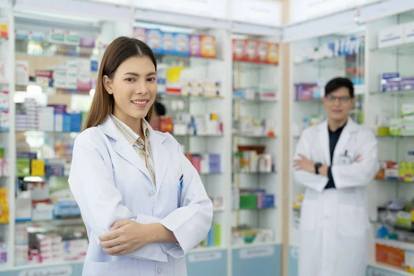 Asian pharmacist woman in pharmacy store of her business for sale a drug and pharmacy