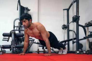 Asian man push ups in GYM for made his muscle and power