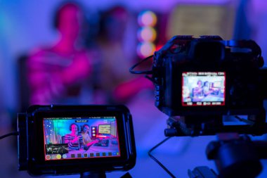 Asian streamer make video streaming for game play and gaming by video maker device and online to website in an internet