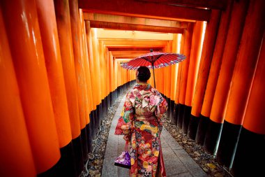 Women in traditional japanese kimonos walking at Fushimi Inari Shrine in Kyoto, Japan, Kimono women and umbrella, Kyoto
