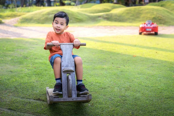 Asian Boy Play Wooded Toy Grass Green Garden City Park — Stock Photo, Image