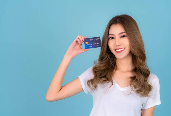 Asian woman show credit card on hand for payment money with isolated background