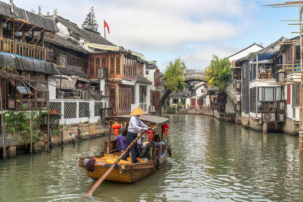 Travel in stone bridge boat and water town in zhouzhuang village in shanghai city , china
