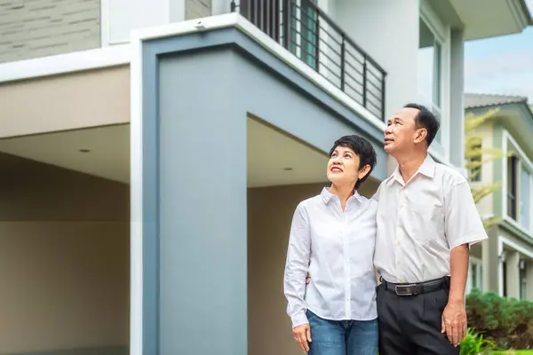 Asian old couple people buy new home from they savings after retirement, new house in village