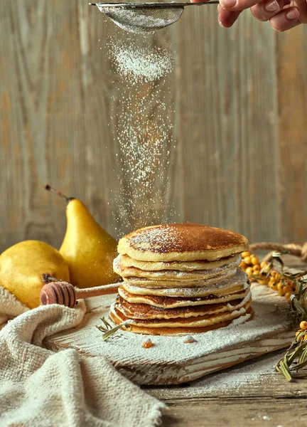 Powdered Sugar Sprinkled Pile Buttermilk Pancakes Pair Pears Distance Small — Stock Photo, Image