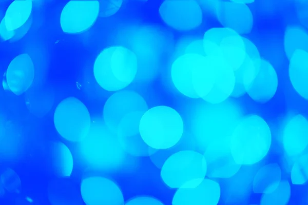 ブルー クリスマス ライト フォーカスからライトアップ クリスマスと新年の抽象的な背景 カスタムデザインのテンプレート お祝いの壁紙 ストック写真