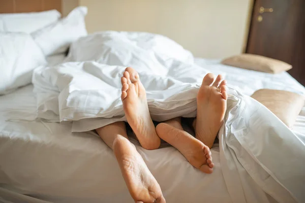 Four Feet Out Bed Blanket Love Sex Concept — 图库照片