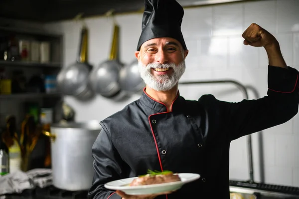 Smiling Chef Uniform Flexing Muscles While Holding Plate Food Professional — Stock Photo, Image