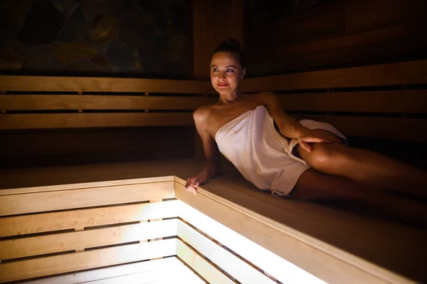 Relaxed Young Female Enjoying Tranquil Moment Dimly Lit Sauna — Stock Photo, Image