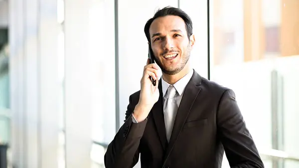 Confident Young Male Professional Suit Talks Mobile Phone Indoors Royalty Free Stock Images