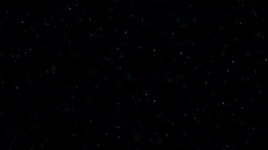 Kara Arkaplanda Toz Parçacıkları. Yıldızlı Parıldayan Parçacıklar. Bokeh Parlak Parçacıklar Döngü Animasyonu. Güzel, rahatlatıcı arka planda