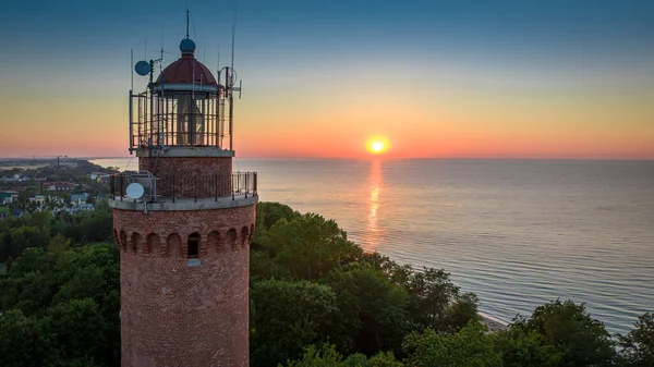 Lighthouse at sunrise by Baltic sea in Poland, Europe