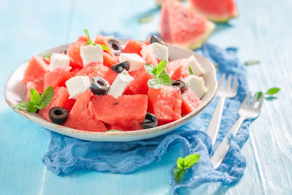 Delicious and healthy watermelon salad with blueberries and nuts. Homegrown fruit harvested in summer.