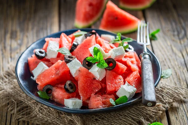 Juicy and fresh watermelon salad made of fresh and healthy ingredients. Homegrown fruit harvested in summer.
